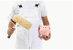 Peintre Granby employee dressed all in white with a scroll in one hand and a piggy bank in pink.